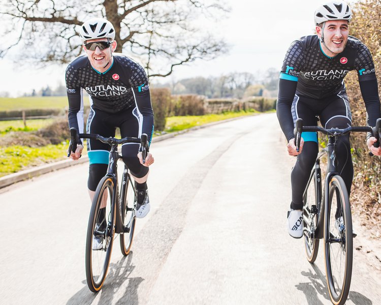 Two men riding bikes